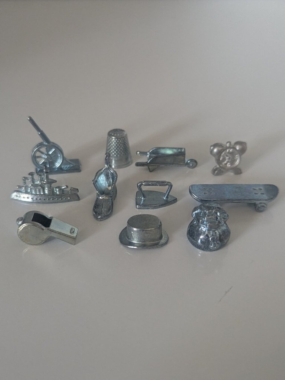 Lot of eleven monopoly pieces including the sought-after skateboard!